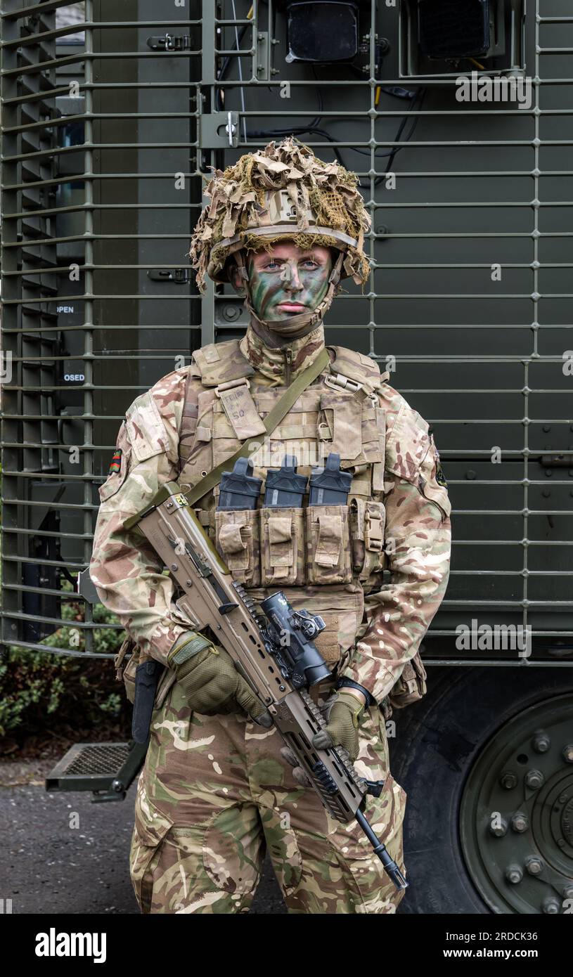 Camouflaged British soldier holding rifle, Redford Army Barracks, Edinburgh, Scotland, UK Stock Photo