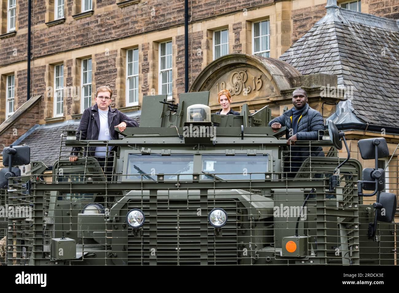 Fringe performers with Mastiff armoured military vehicle, Redford Army Barracks, Edinburgh, Scotland, UK Stock Photo