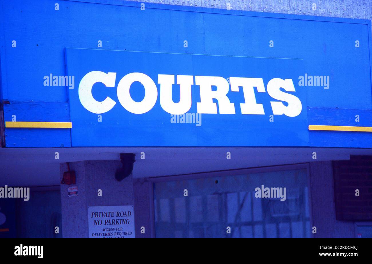 Signage outside a branch of the Courts home furnishing and electrical stores at Ashford in Kent, England on May 1, 2005. Founded in 1850, all 89 UK stores ceased trading in 2004. Stock Photo