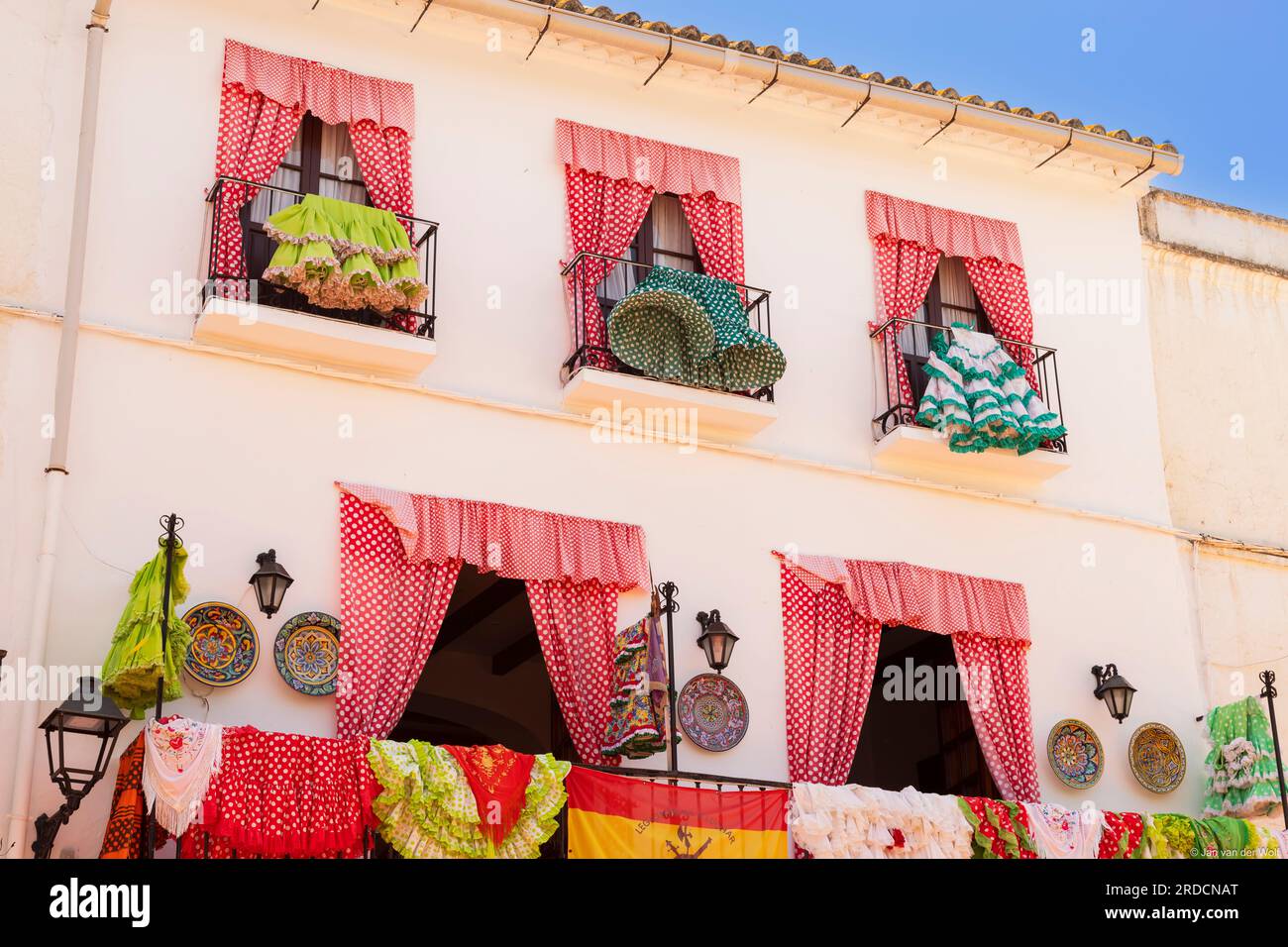 Colorful Spanish flamenco dresses hanging and drying on the balcony, Marbella; Spain. Stock Photo