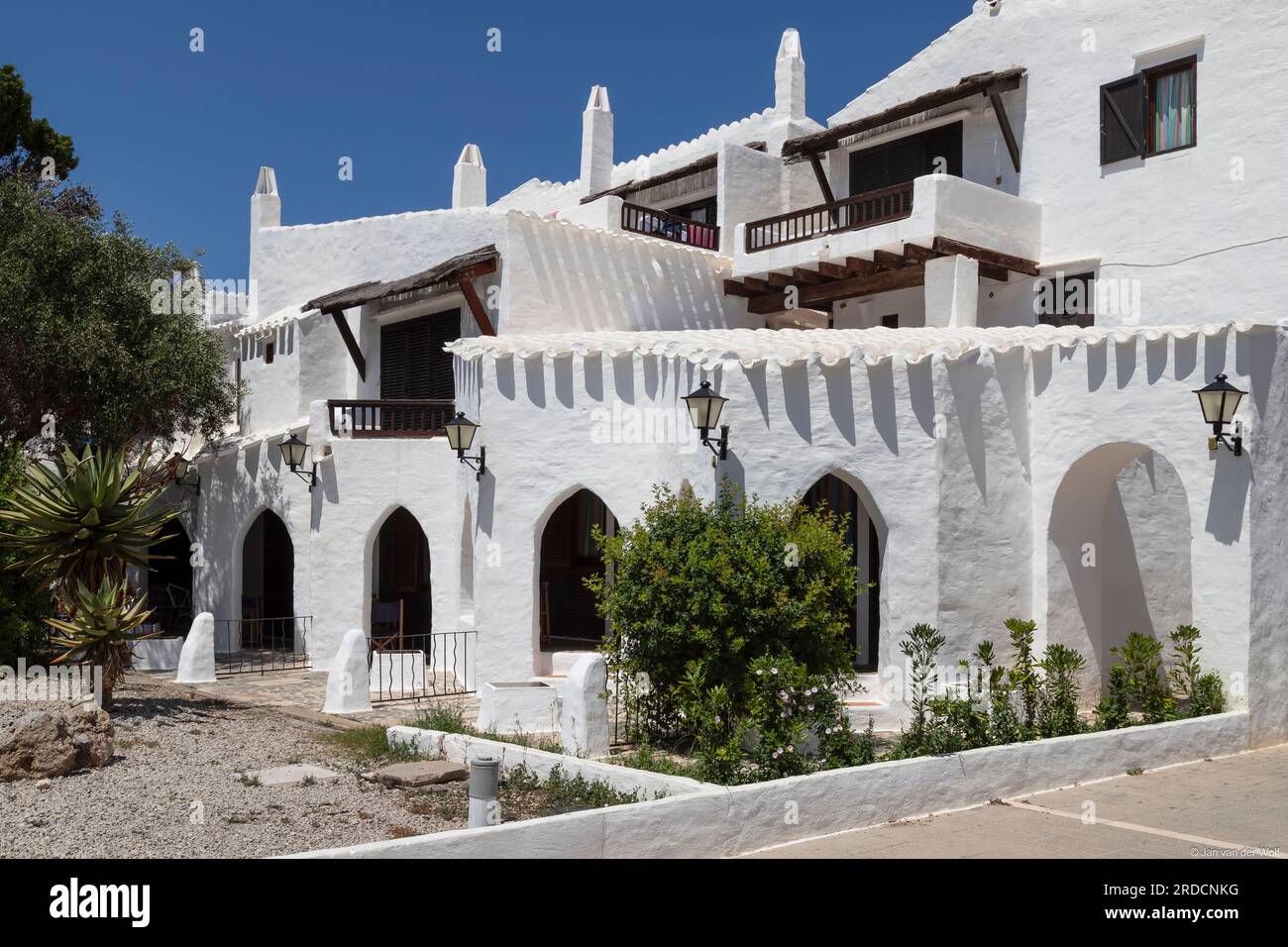 White houses in the picturesque coastal village of Binibequer on the Spanish island of Menorca. Stock Photo