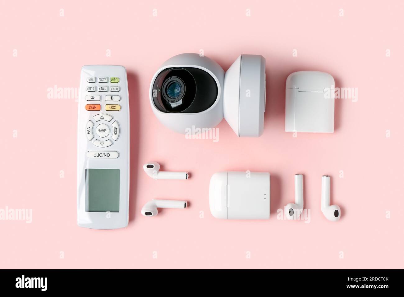 Modern gadgets on pink background Stock Photo