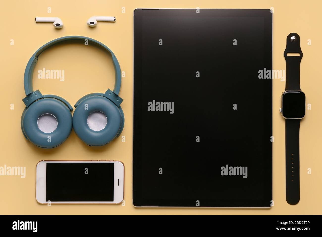 Modern gadgets on yellow background Stock Photo