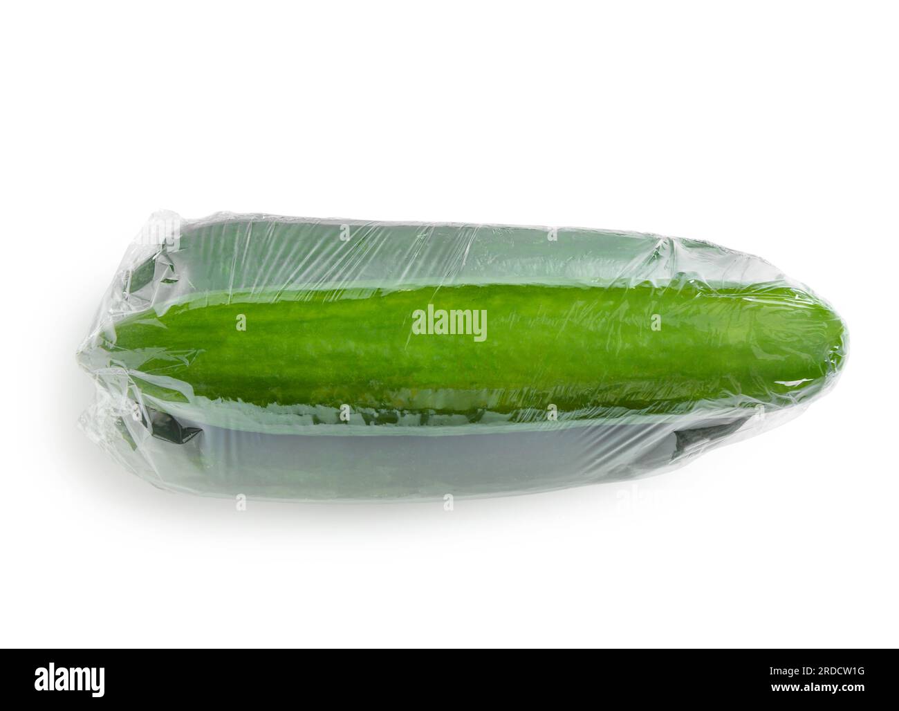 Cucumber in plastic food wrap on white background Stock Photo Alamy