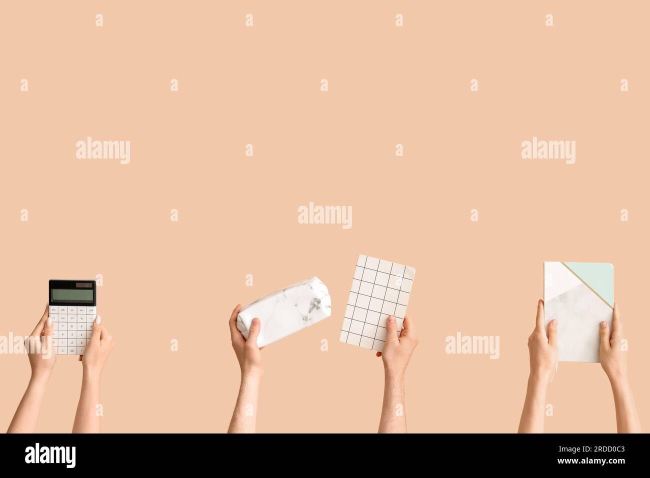 Hands with school supplies on beige background Stock Photo - Alamy