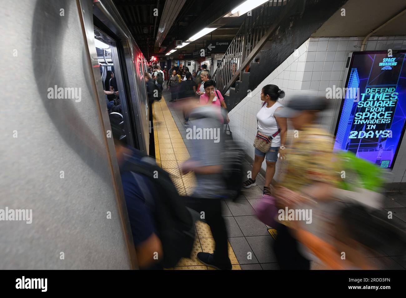 New York, USA. 20th July, 2023. Commuters board the subway as the MTA