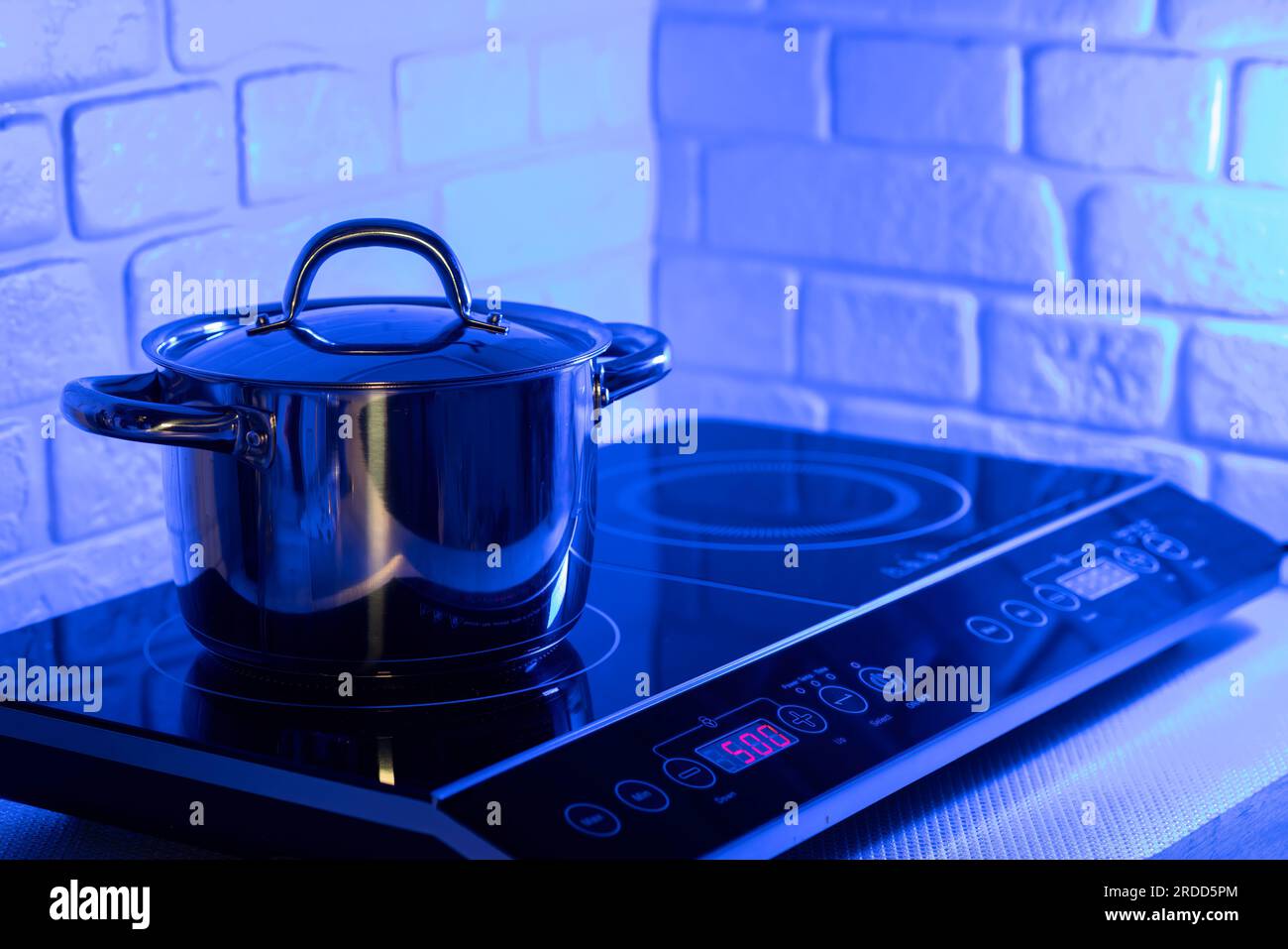 Metal Pot on induction hob in modern kitchen Stock Photo Alamy