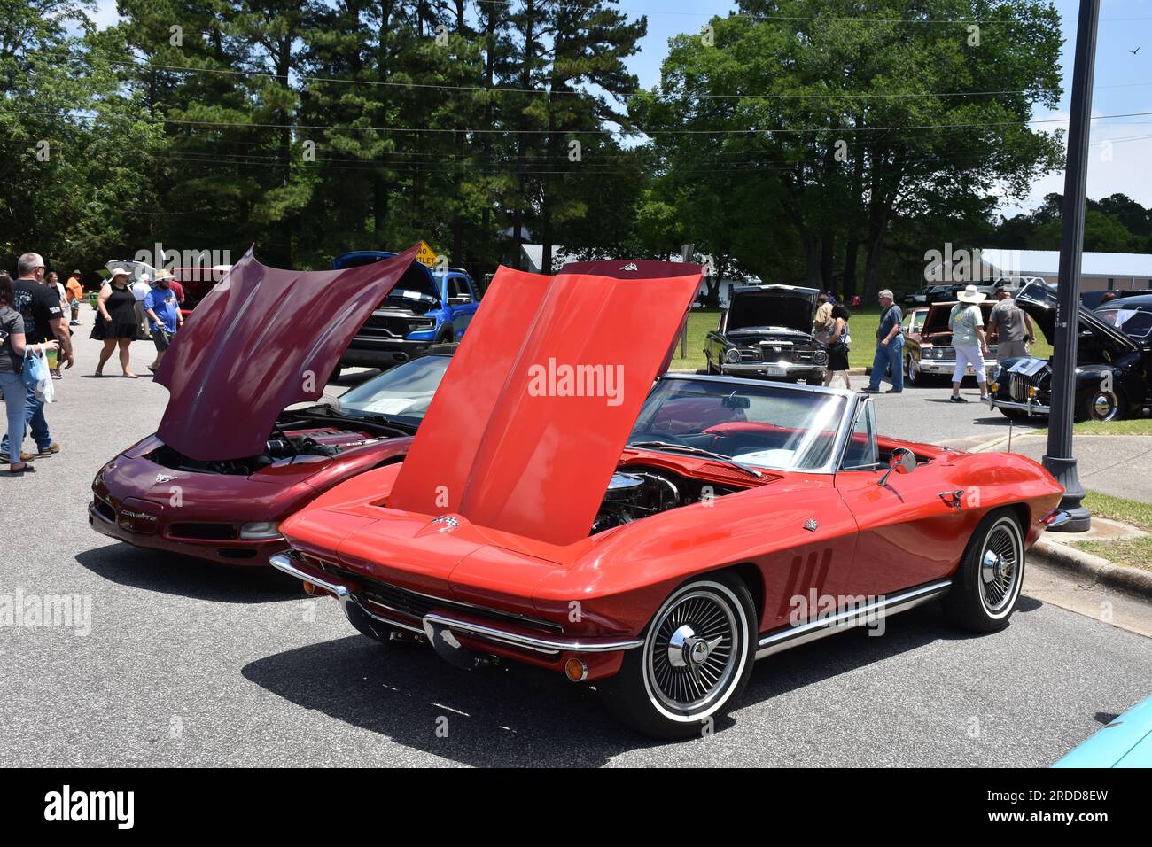 A 1965 Red C2 Chevrolet Corvette Convertible on display at a car show. Stock Photo