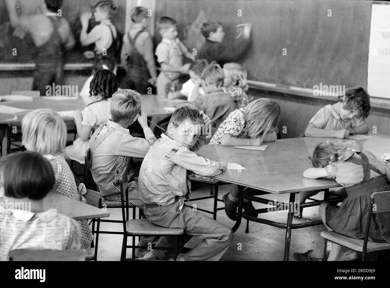 Children of migratory workers in third grad class, Farm Security Administration (FSA) migratory labor camp, Weslaco, Texas, USA, Arthur Rothstein, U.S. Farm Security Administration, February 1942 Stock Photo