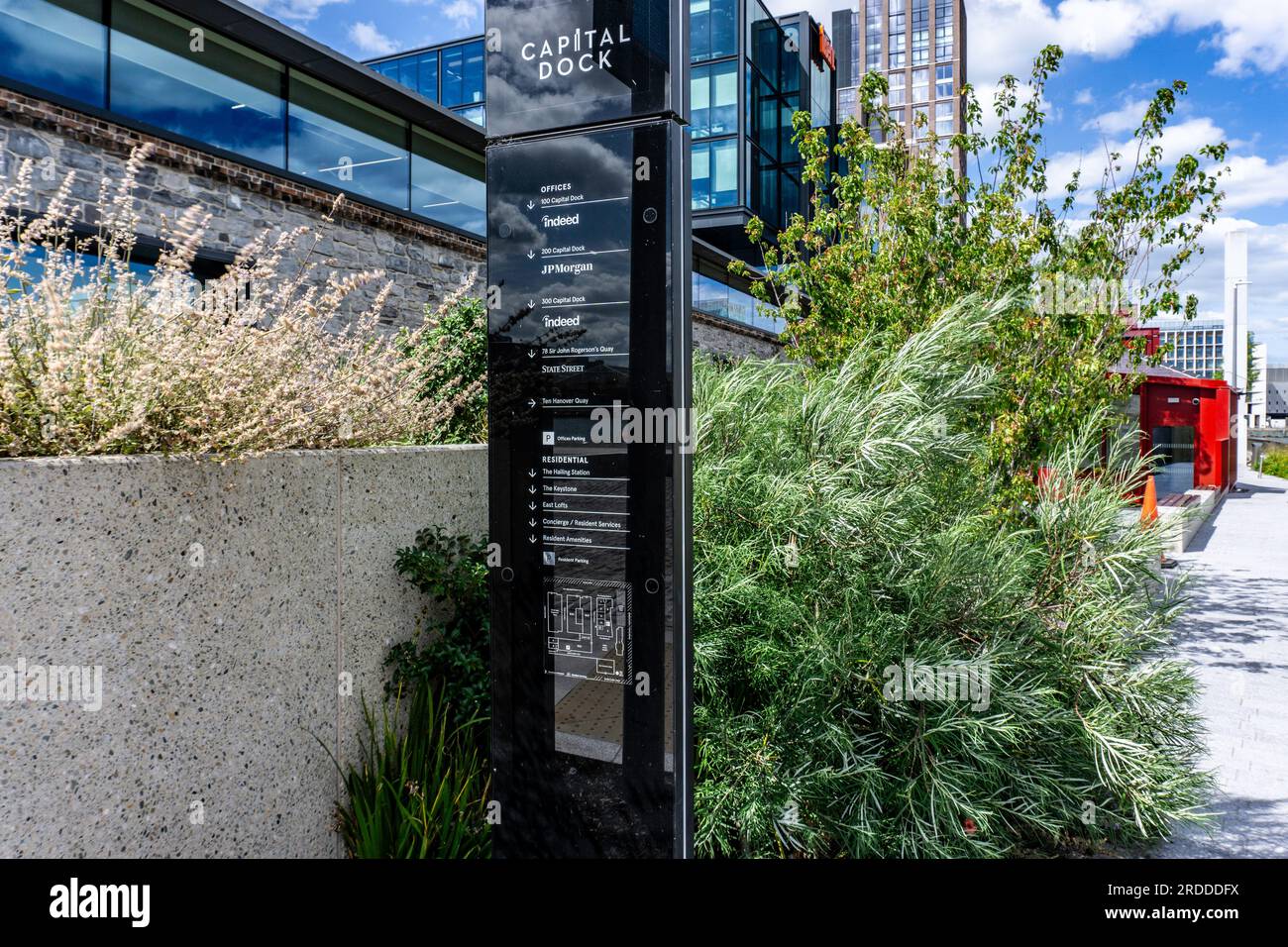 Signage for businesses based in Capital Dock, a 22 storey mixed use development of offices and apartments on Sir John Rogersons Quay, Dublin, Ireland. Stock Photo