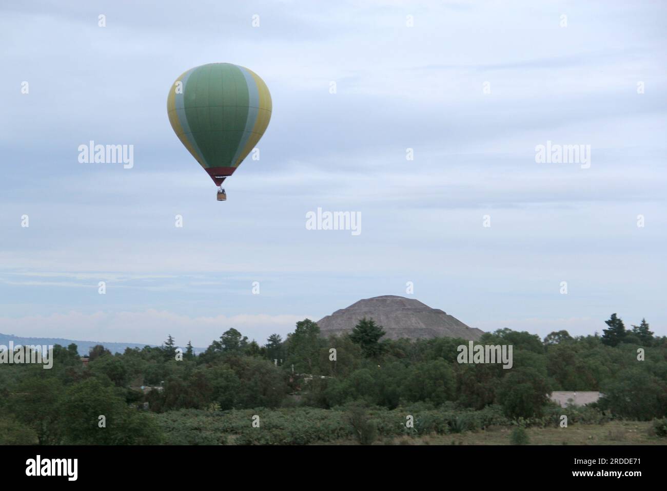 Landscape with vegetation, hot air balloon and pyramid in Teotihuacan ...