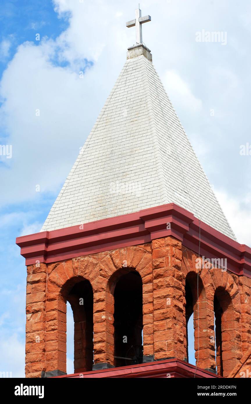 Bell town on the Grace Christian Church is designed with locally mined red sandstone.  It is located in Houghton, Michigan and is over 100 years old. Stock Photo