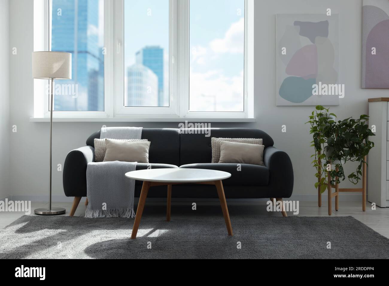 Picture of Stylish living room with gray couch, white coffee table and lamp ...