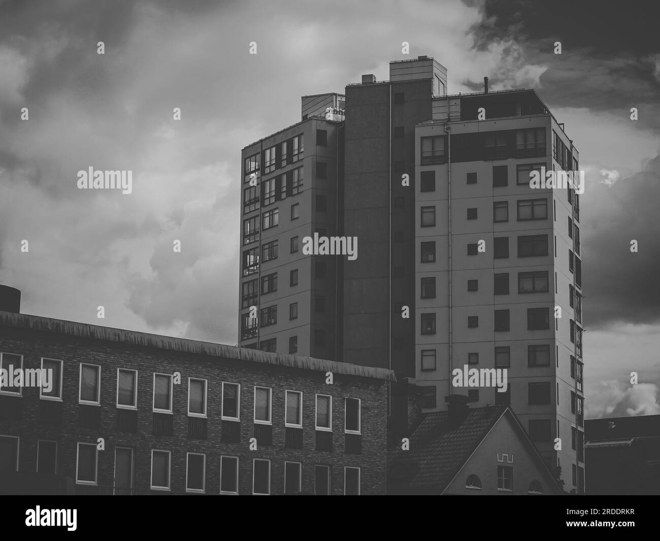 a tall building in a city in black and white Stock Photo - Alamy