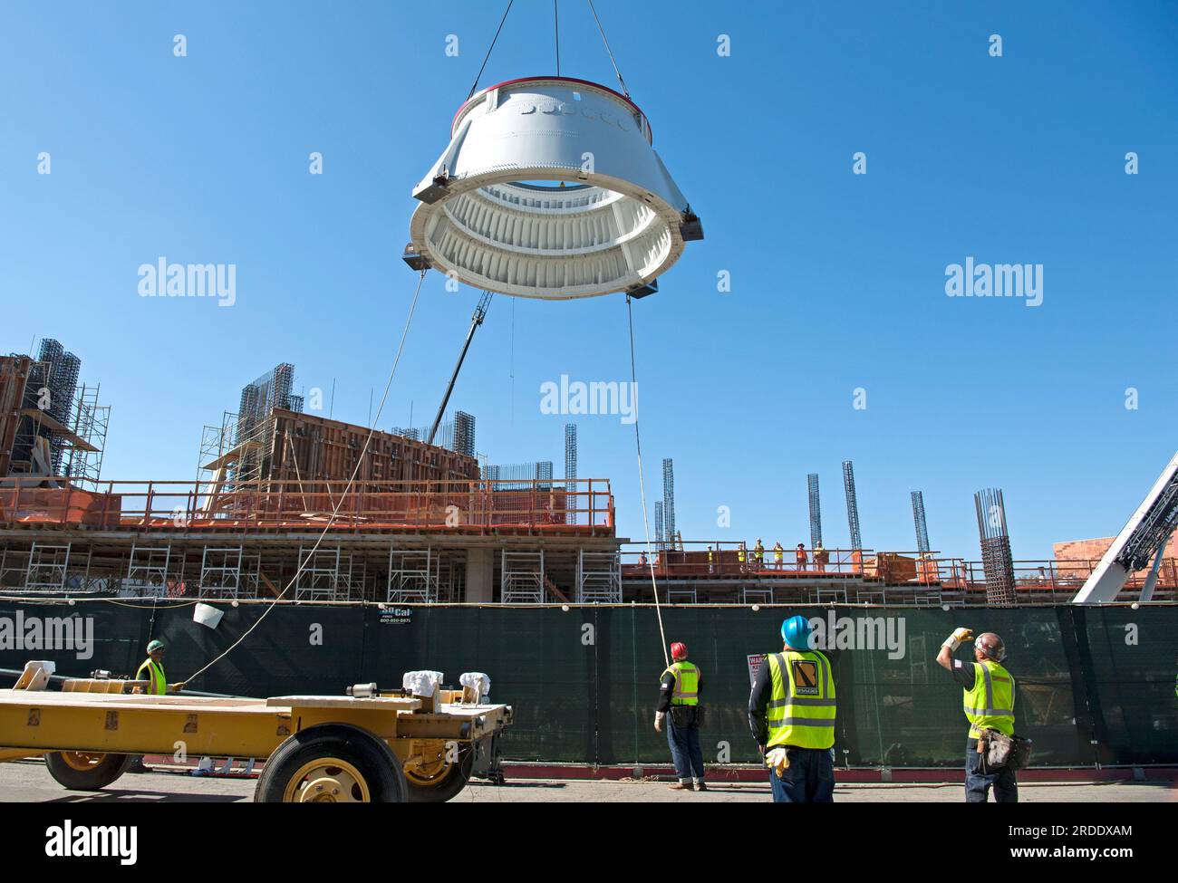 One of the aft skirts of the Endeavor Space Shuttle being lifted by ...