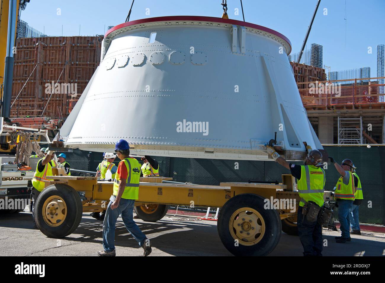 Workmen transporting one of the aft skirts of the Endeavor Space Shuttle into position for installation at the California Science Center, L.A., CA. Stock Photo