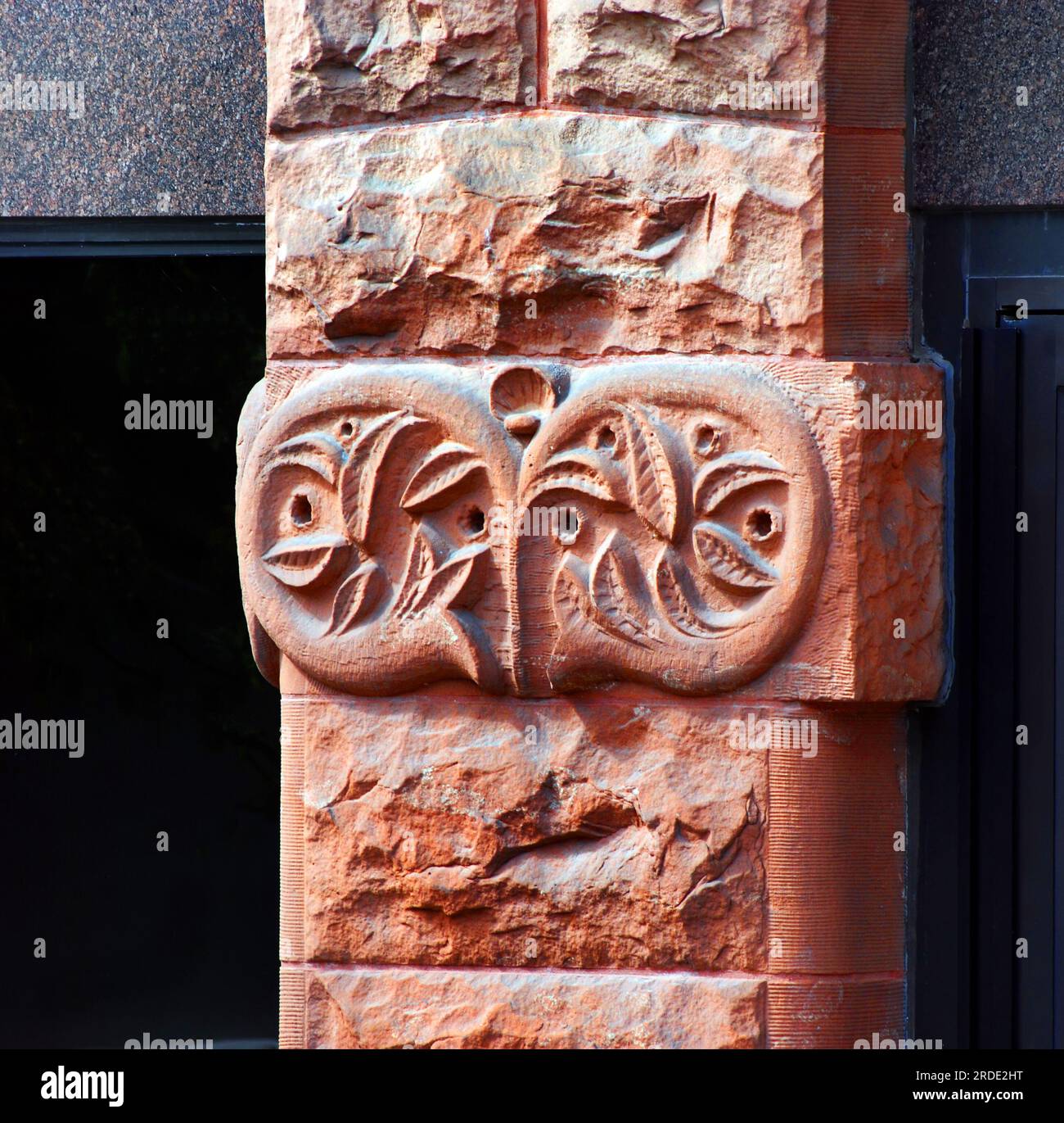 Red sandstone column is built of sandstone blocks locally mined in the