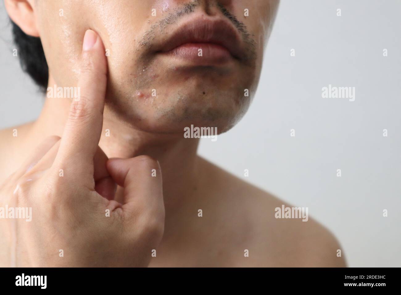 Close up of men doing skin care Stock Photo