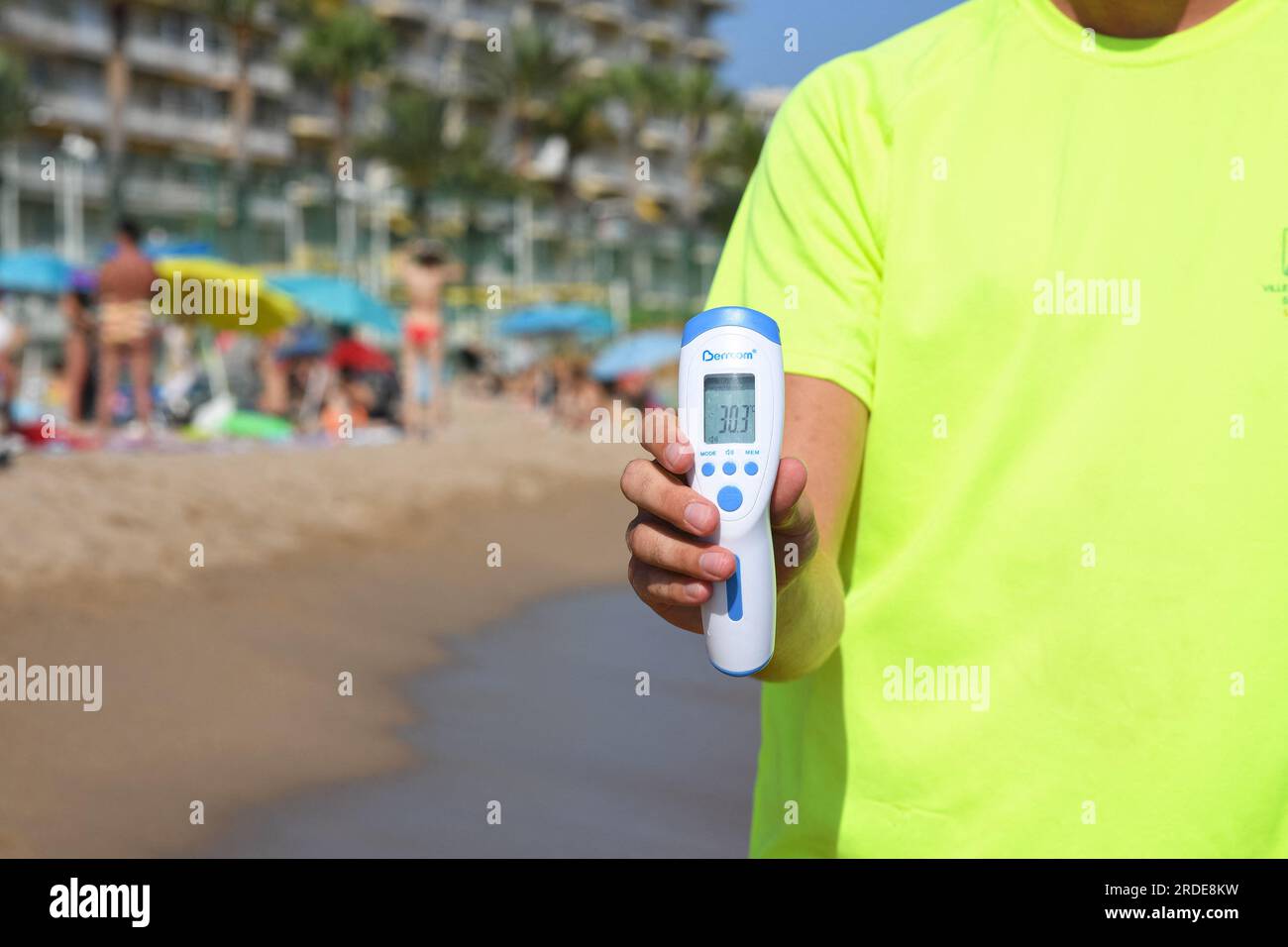 Cannes, France. 20th July, 2023. A lifeguard checks water's temperature