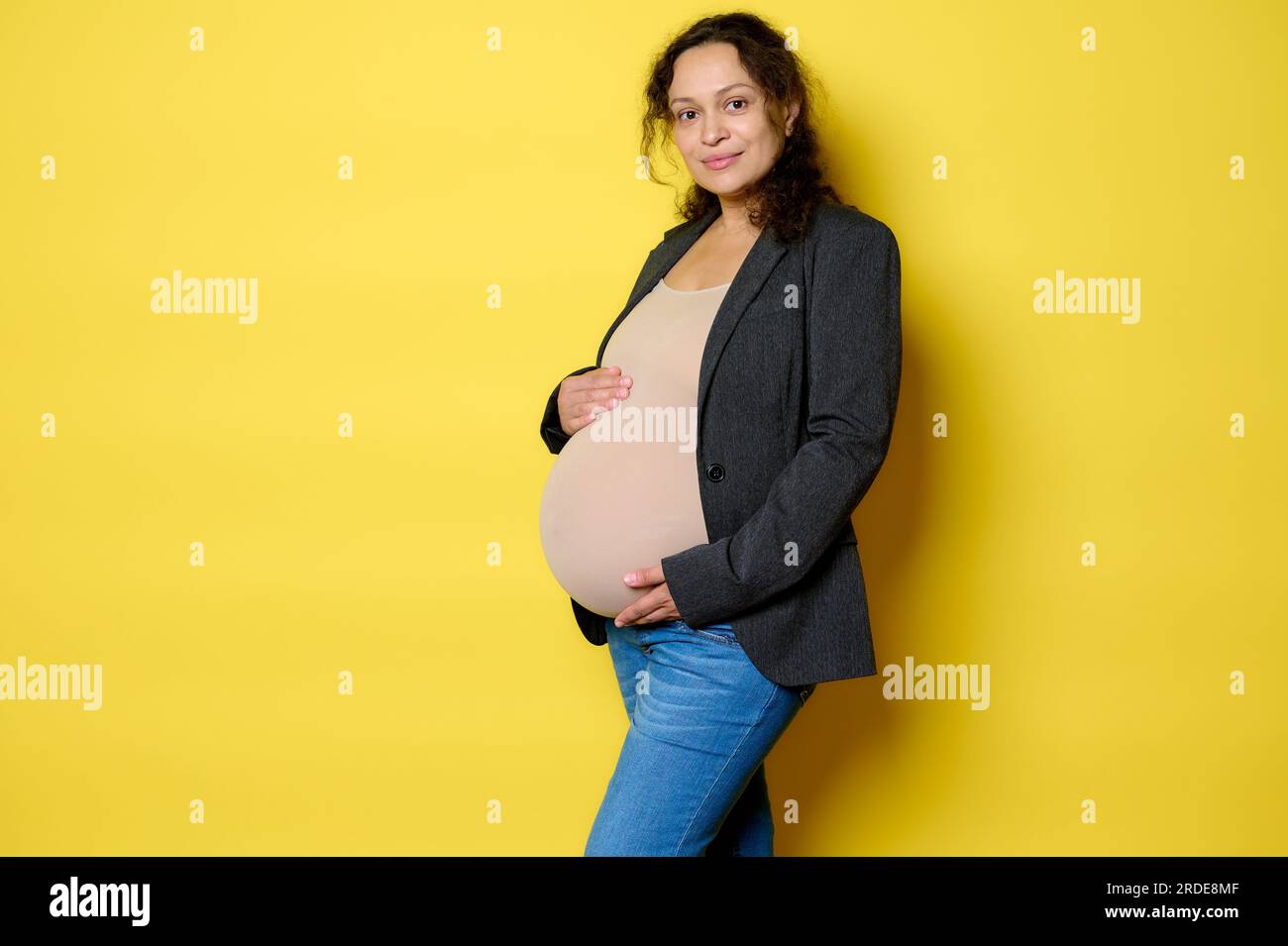 Attractive pregnant woman poses camera hi-res stock photography and ...