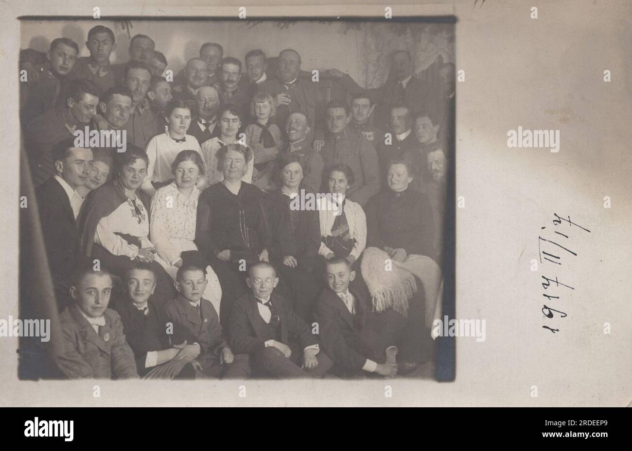 school class photo and reunion photo togedher from 1917.02.17. the members of the reunion class are serving in the austro-hungarian army as the great war is still on the little boys are too young to give military service. Stock Photo