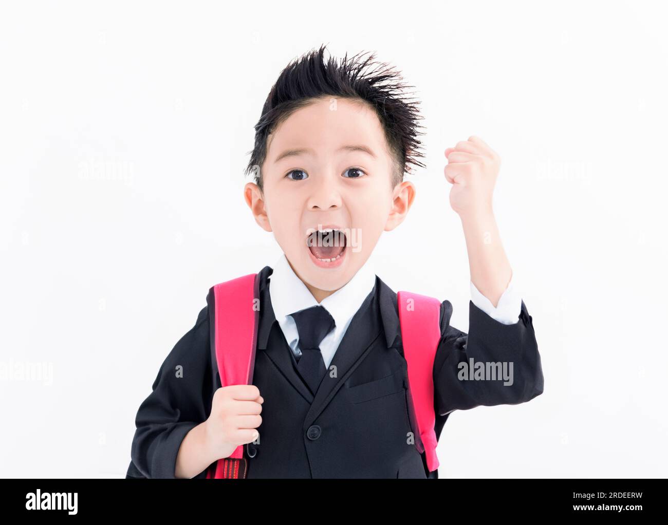 Excited Boy in student uniform isolated on white background Stock Photo