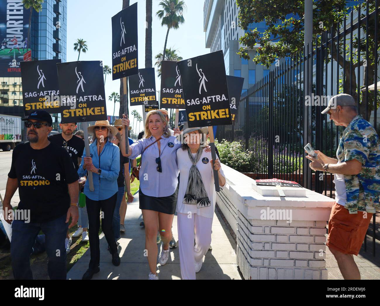 Hollywood, California, U.S.A. 20th July, 2023. Jane Fonda, Lily Tomlin,  June Diane Raphael, all part of the cast of the seven-season hit Netflix TV  show Grace and Frankie, walk the SAG-AFTRA/WGA picket