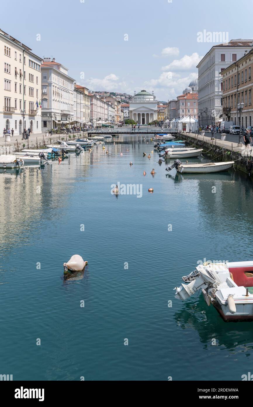 TRIESTE, ITALY - may 29 2023: cityscape with sant Antonio Classical church at Canal Grande end, shot in bright light on may 29, 2023 at Trieste, Friul Stock Photo