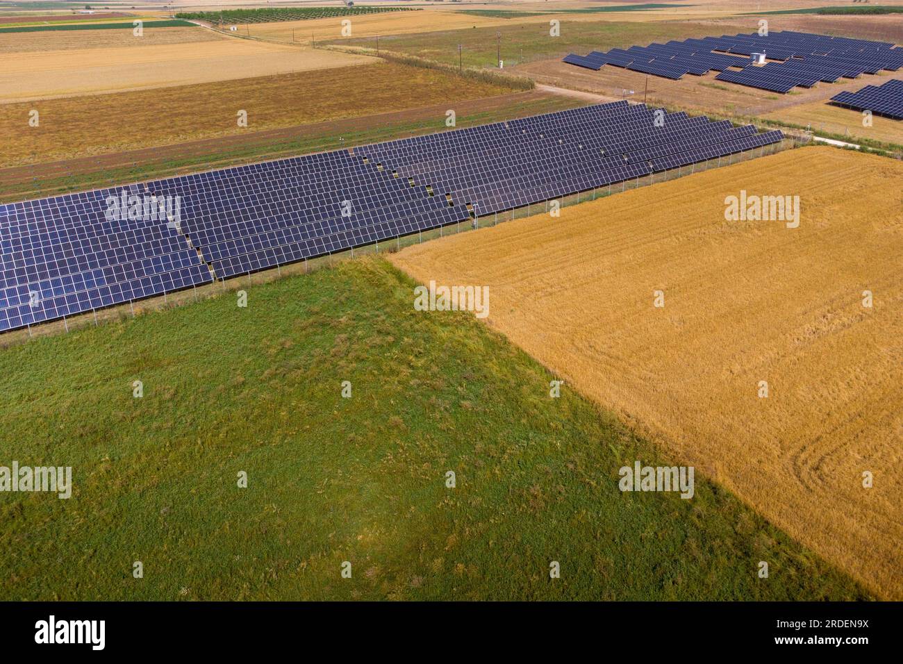 Renewable energy source solar panels or photovoltaic panels in the fields of Thessalys plain , Greece. Stock Photo
