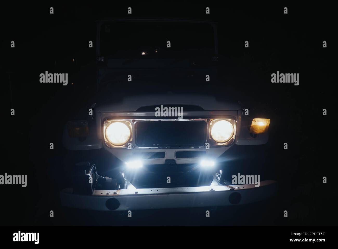 The headlights of a vintage or classic off-road vehicle or full-sized