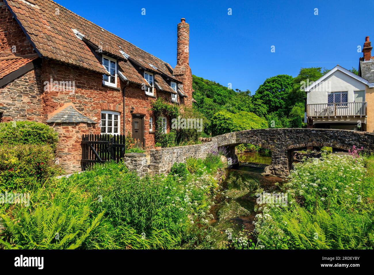 Traditional stone cottages and the historic pack horse bridge at Allerford on the Holnicote