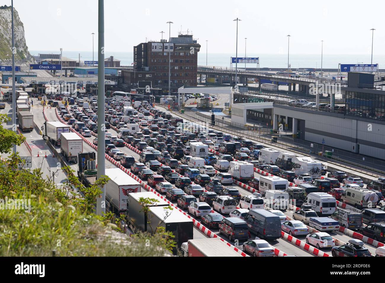 Lorries and cars queue at the Port of Dover, Kent, as the busy summer ...