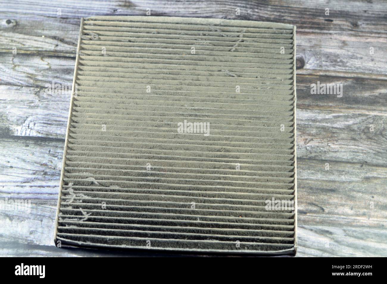 old dirty used car AC air conditioning filter full of dust removed from