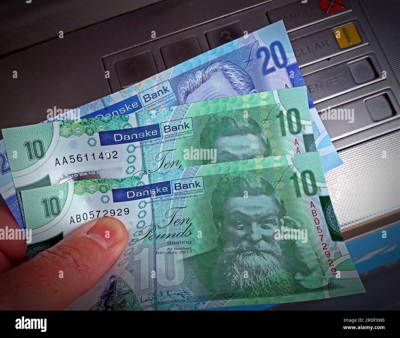 Danske Bank northern Irish Sterling cash notes dispensed from an ATM cash machine, in Londonderry city, Northern Ireland, UK, BT48 7BB Stock Photo