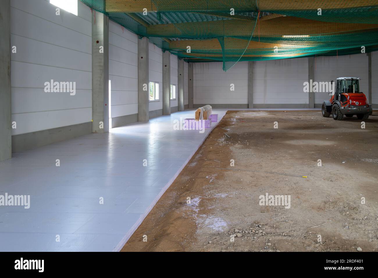 many styrofoam panels are laid on the floor of a newly built factory