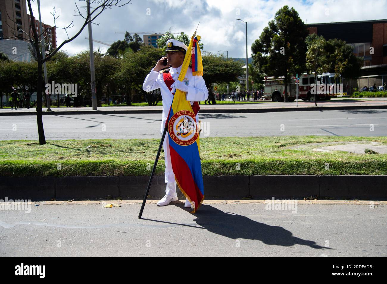 A Colombian Navy official holds a Colombian flag during the military parade for the 213 years of Colombia's independence, in Bogota, July 20, 2023. Stock Photo