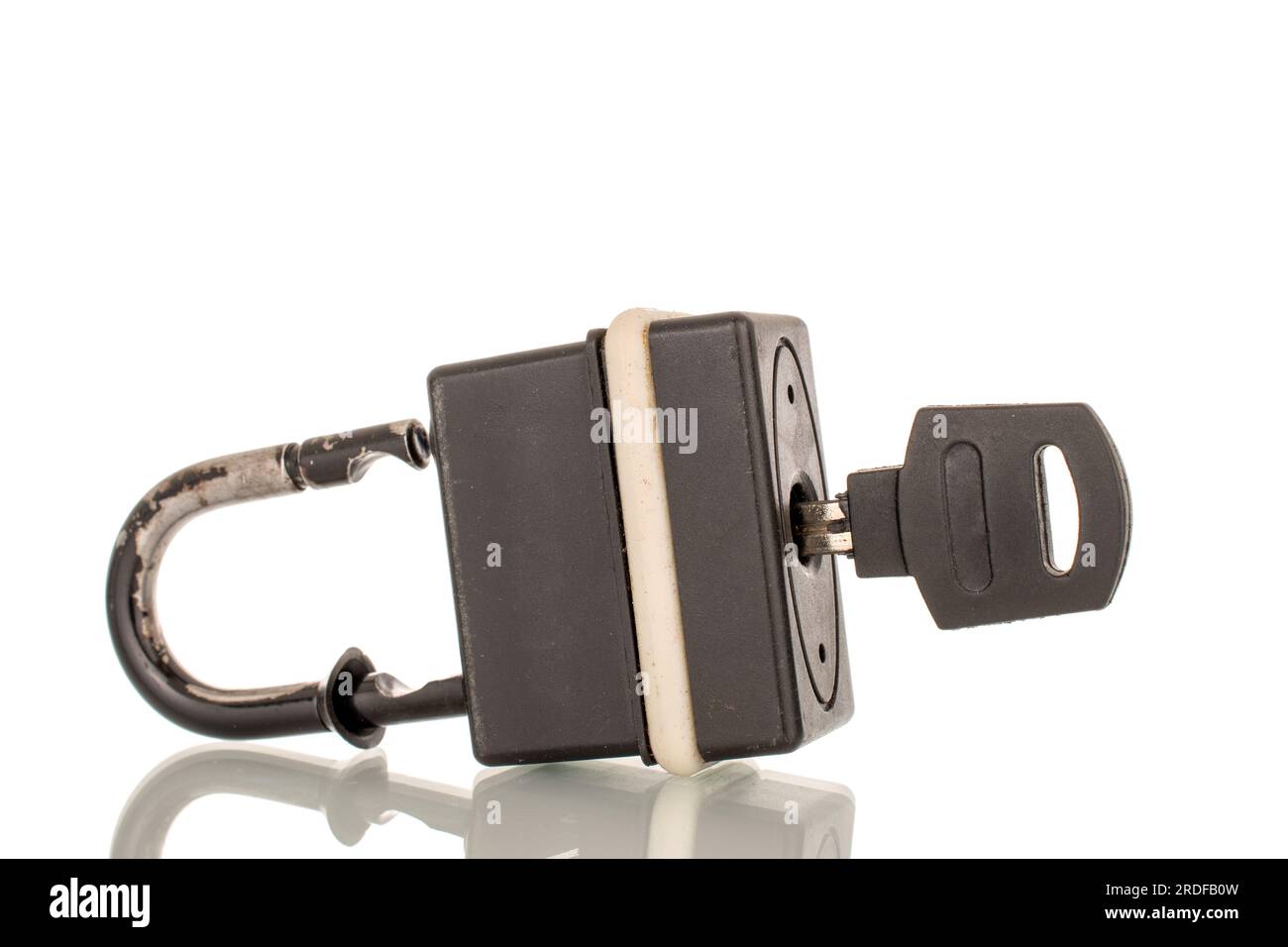 One metal lock with key, macro, isolated on white background Stock ...