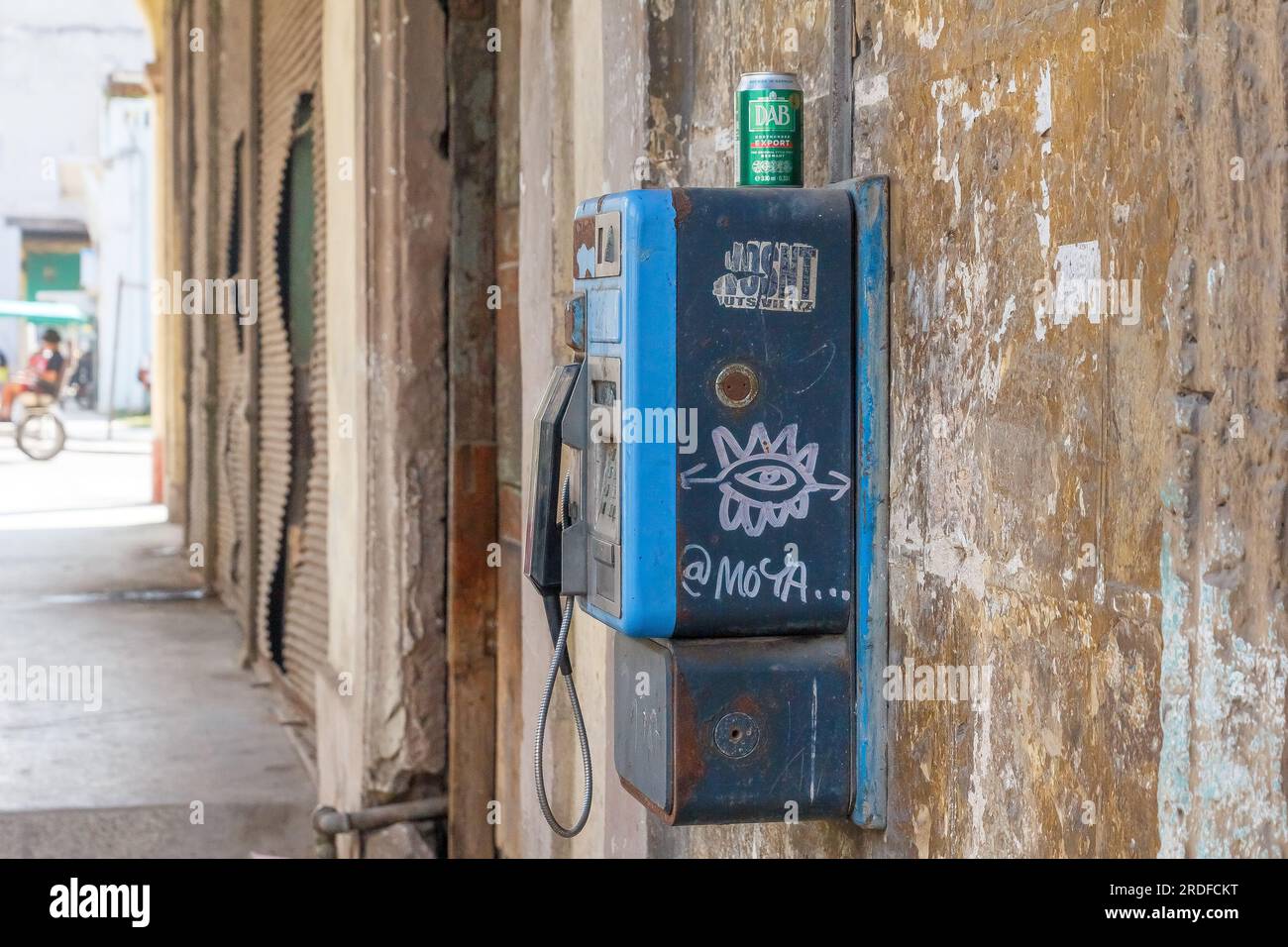 Havana, Cuba - May 27, 2023:  A can of Bavaria beer has been left on top of a payphone operated by Etecsa, the only telecommunication company in the c Stock Photo