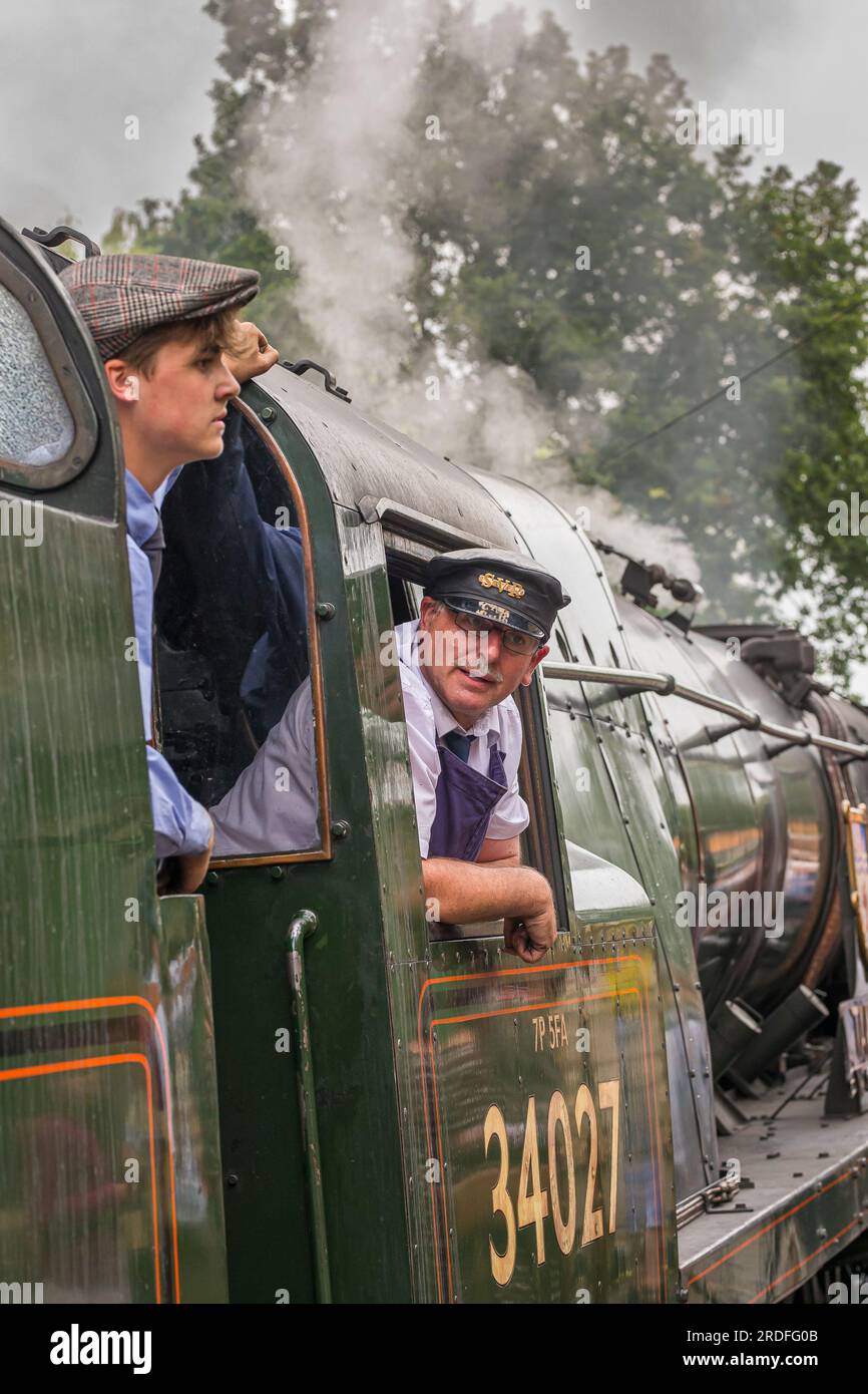 Crew of vintage steam locomotive aboard the 34027 on the Severn Valley ...