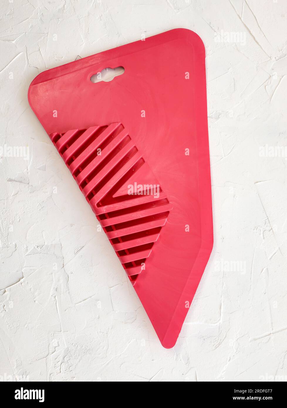 Putty knife and plastic spatula on a white background. Building tool