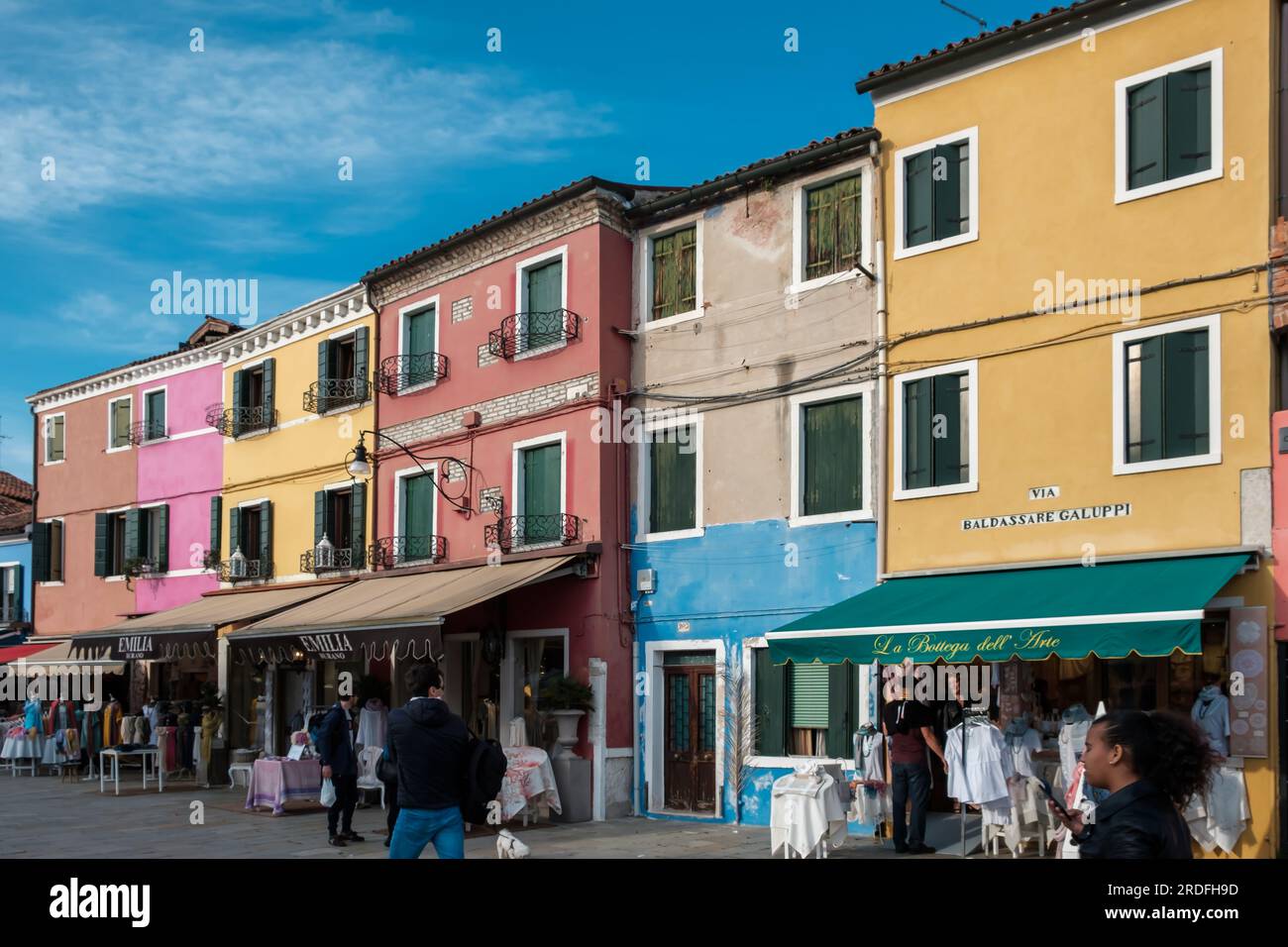 Burano, Italy - April 27, 2019 : Burano island in the Venetian lagoon, with its brightly coloured homes, souvenir shops and restaurants Stock Photo