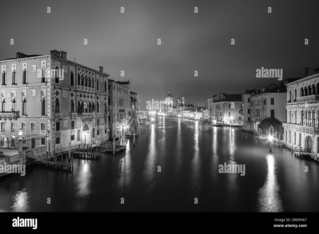 Venice,  Italy - April 27, 2019 : Panoramic view of the beautiful  illuminated grand Canal in Venice Italy in black and white Stock Photo