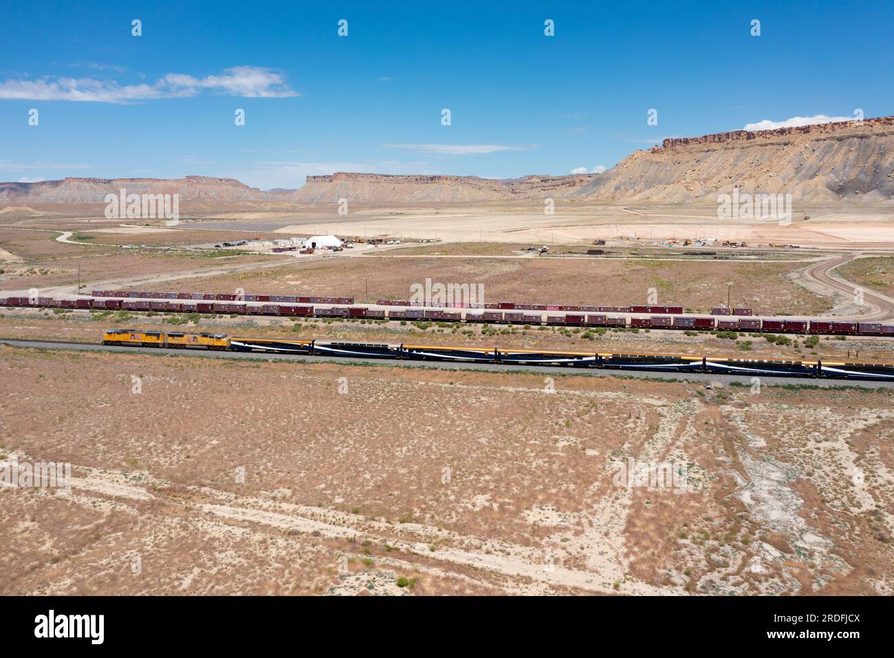 A passenger train passes the UMTRA permanent deposition site for