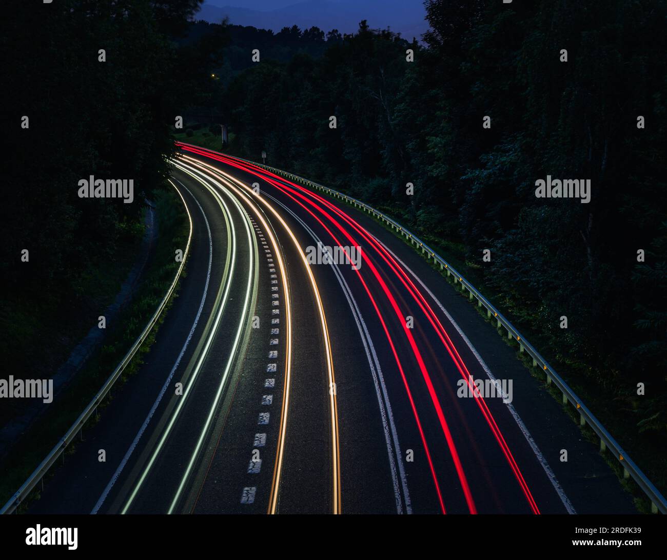 Photograph of car trails taken at blue hour in Unbe, Erandio (Bizkaia, Spain), with Olympus Live Composite mode. Stock Photo
