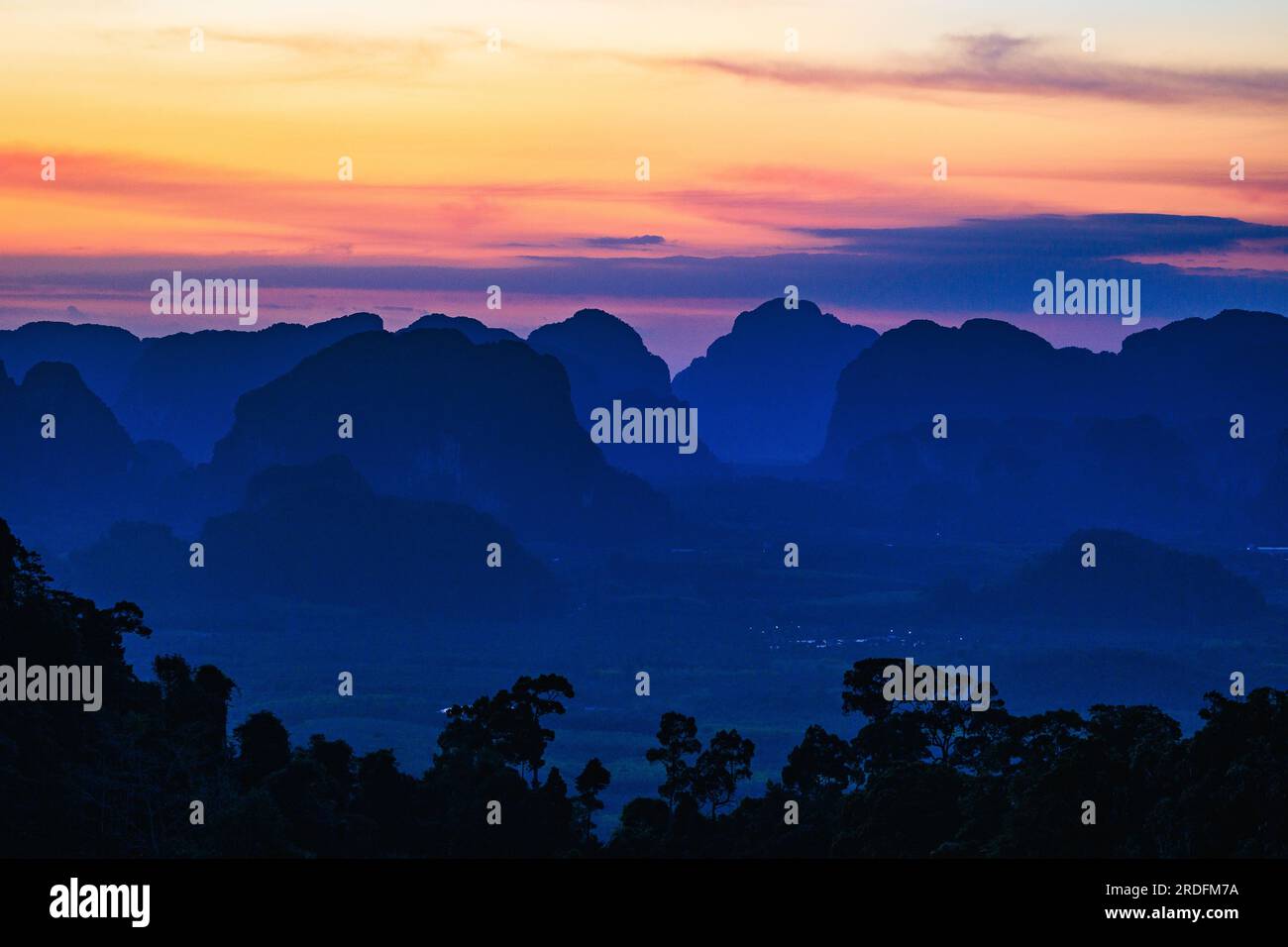 Last daylight over the Krabi hills, view from the Tiger cave temple, Thailand Stock Photo