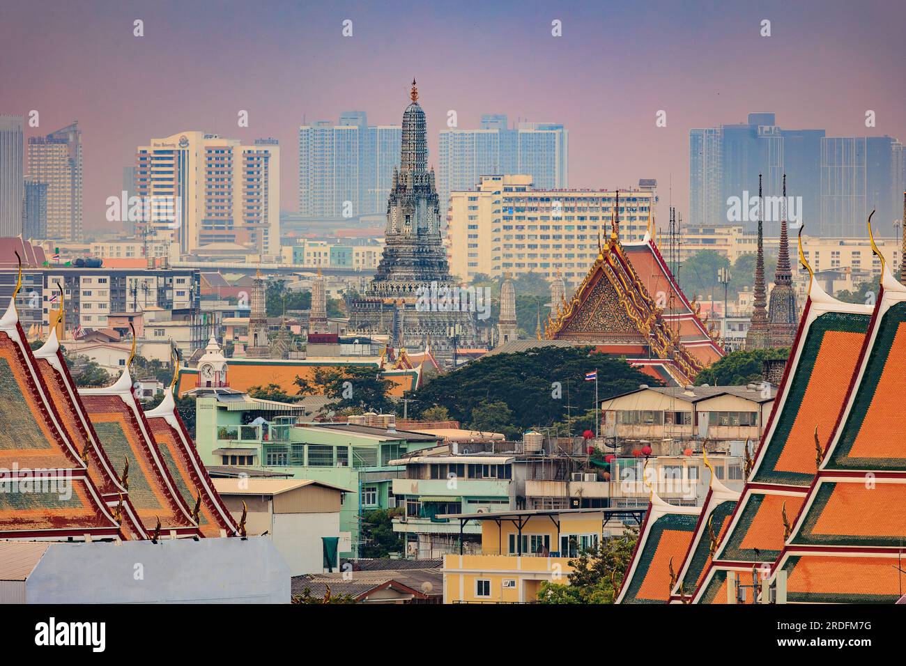 View on the Bangkok old city and the Wat Arun temple with modern city. Stock Photo