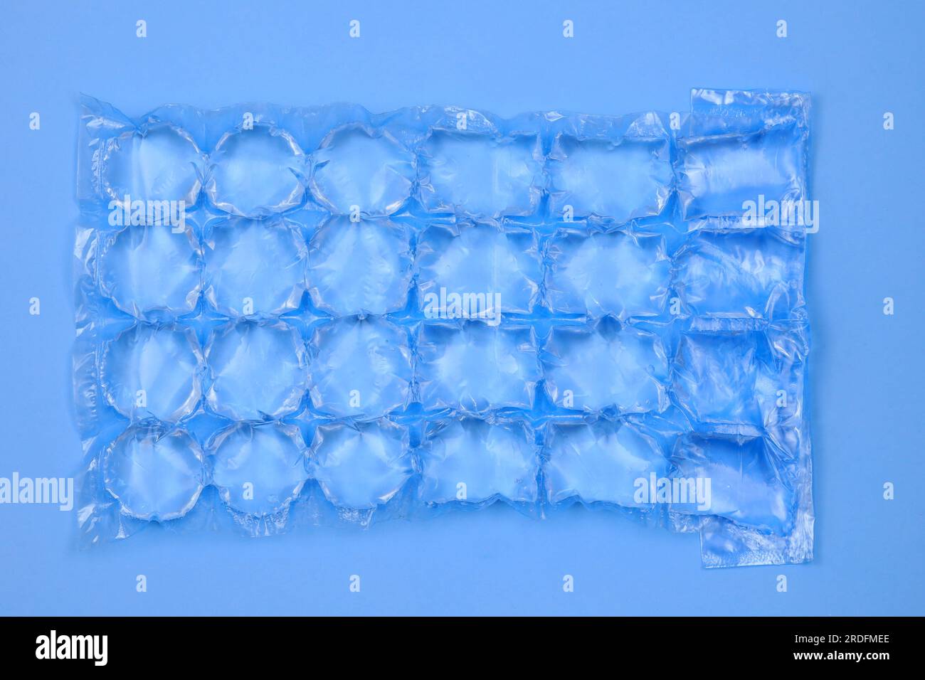 Plastic bag with water for ice closeup. Blue plastic packaging ice