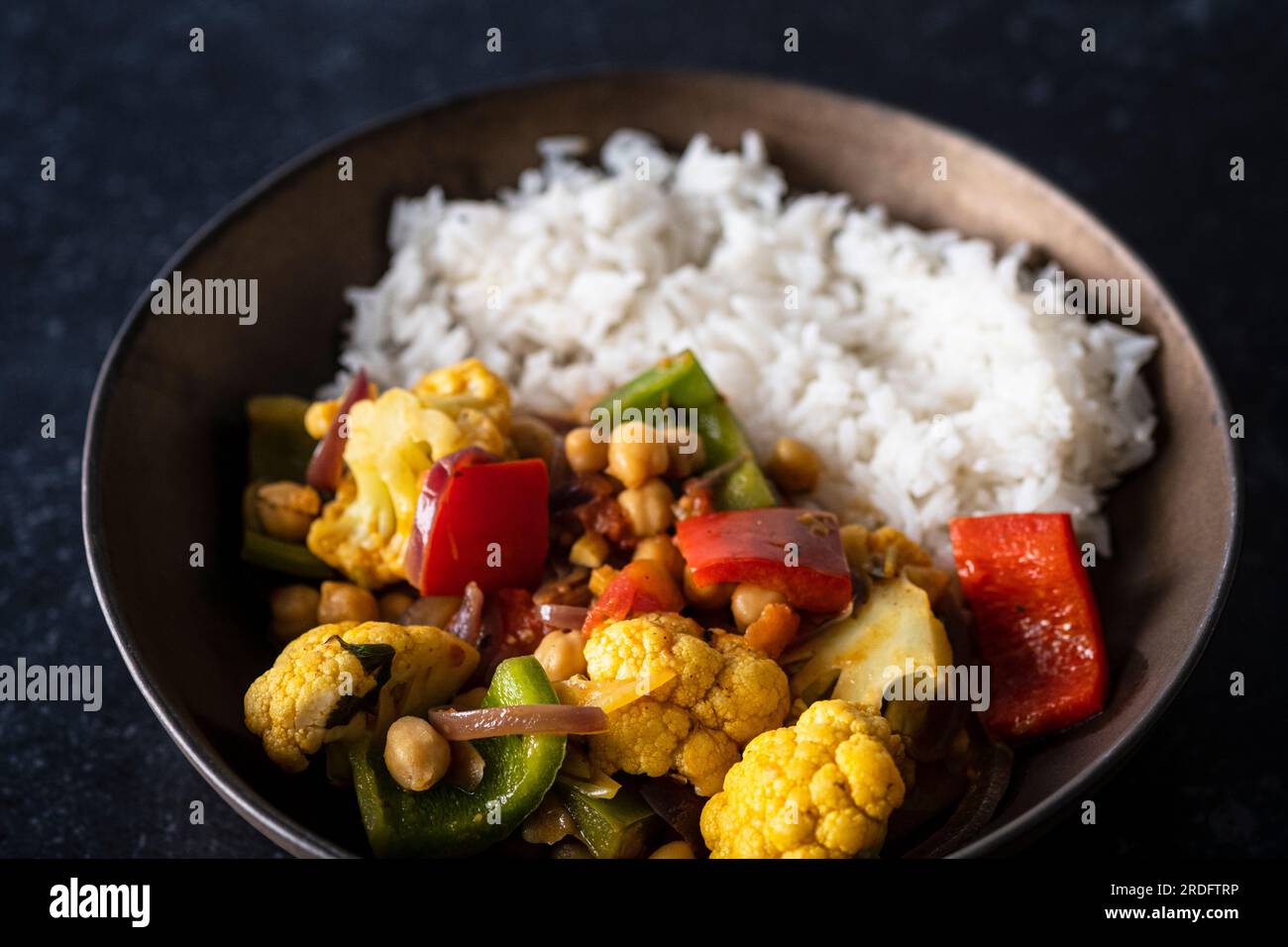 Vegetables jalfrezi with basmati rice Stock Photo Alamy