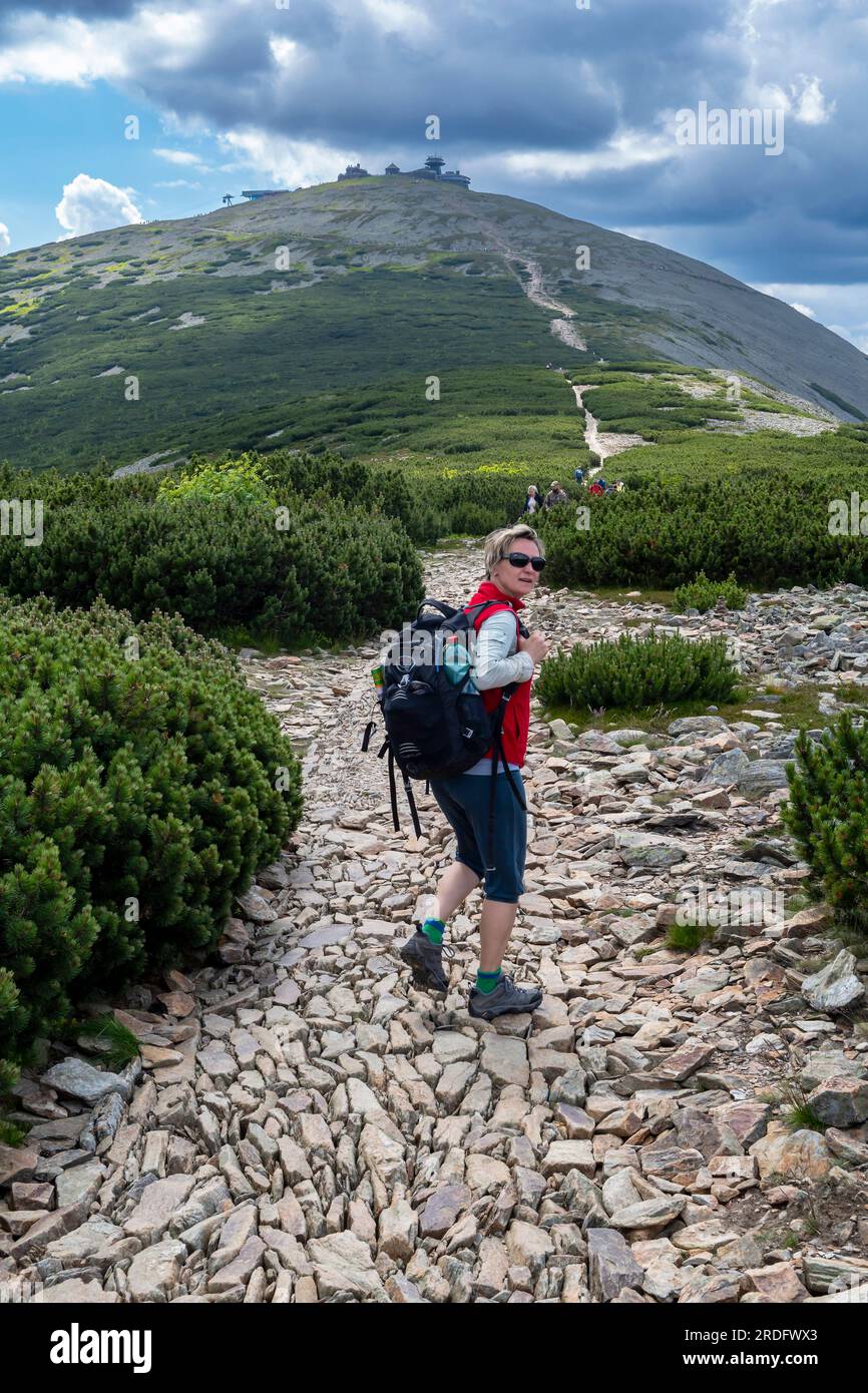 woman summer day walk in czech mountains Giant Mountains Krkonose and peak Snezka Stock Photo