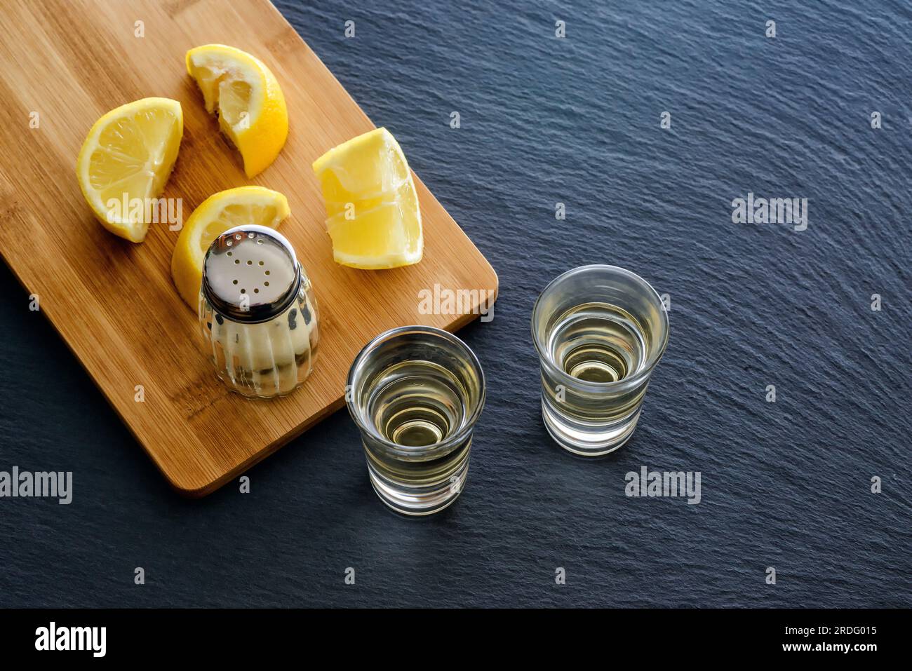 shot glasses with tequila, salt and lemons Stock Photo Alamy